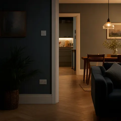 Living room in darkness with light coming from the next room